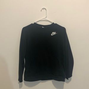 This is a black sweatshirt with a small Nike sign on the left side in the front!
